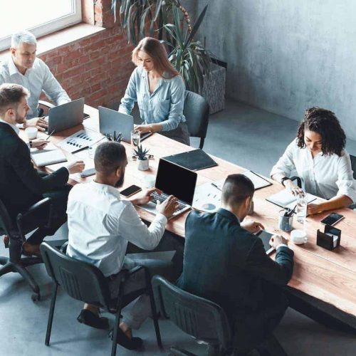 multiethnic-business-team-working-together-sitting-in-modern-office-panorama.jpg